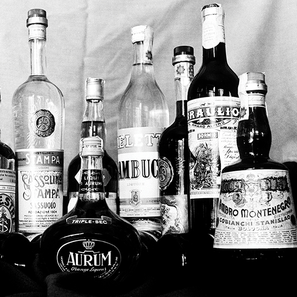 Black and white vintage photo of a variety of Italian bitters bottles