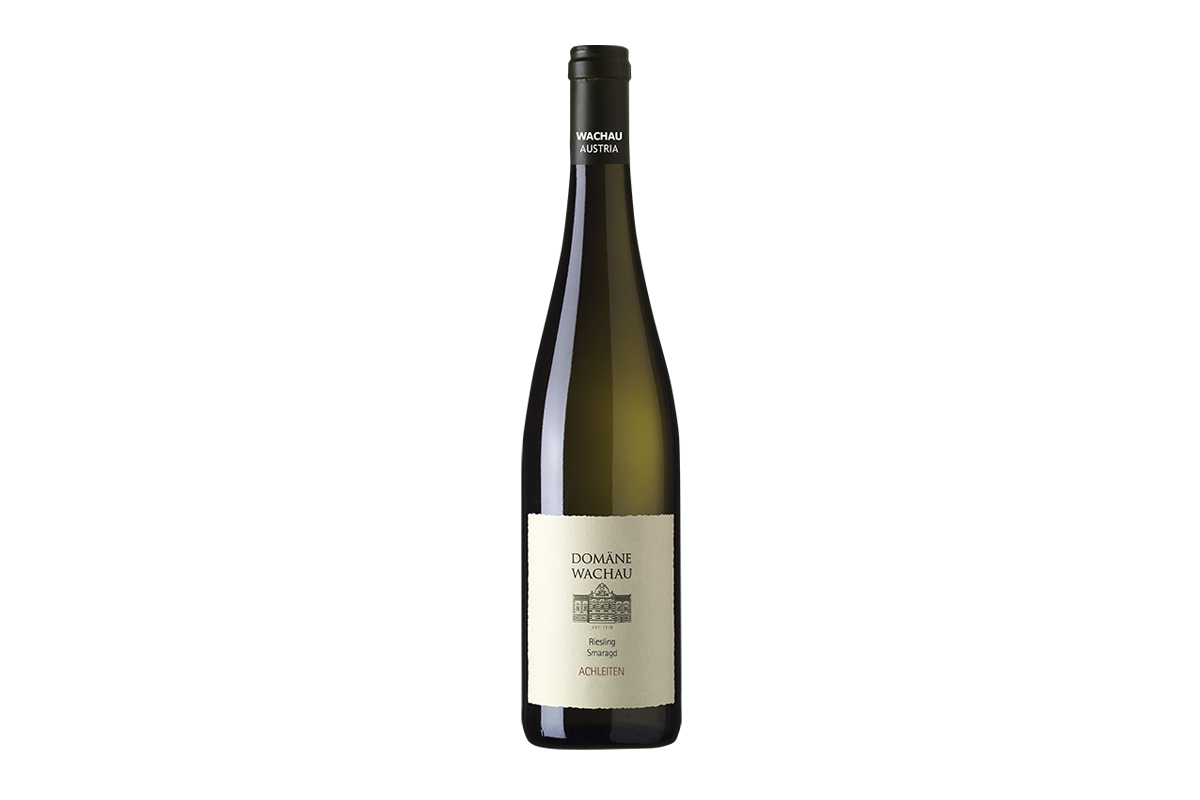 A bottle of Domäne Wachau Riesling Smaragd Achleiten. Grapes sourced from Achleiten, a celebrated vineyard in southern Austria known for producing fruit that imparts into wine a smoky, mineral-forward character. 