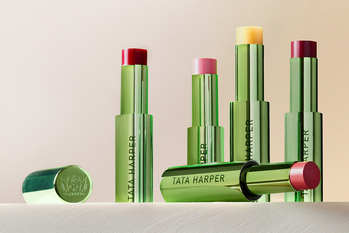 A group of Tata Harper lip crèmes in various colors sitting on a table.