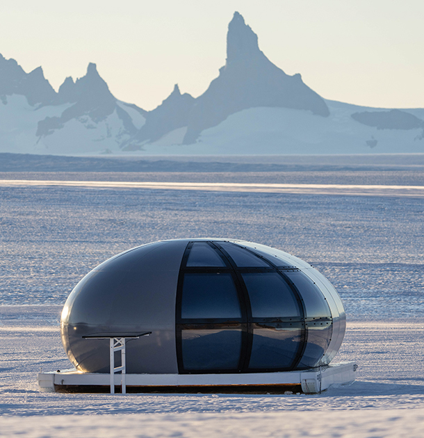Exterior of a Sky Pod at Echo Camp, a futuristic, carbon-composite bubble pod used for lodging accommodations on Queen Maud Land, Antarctica.