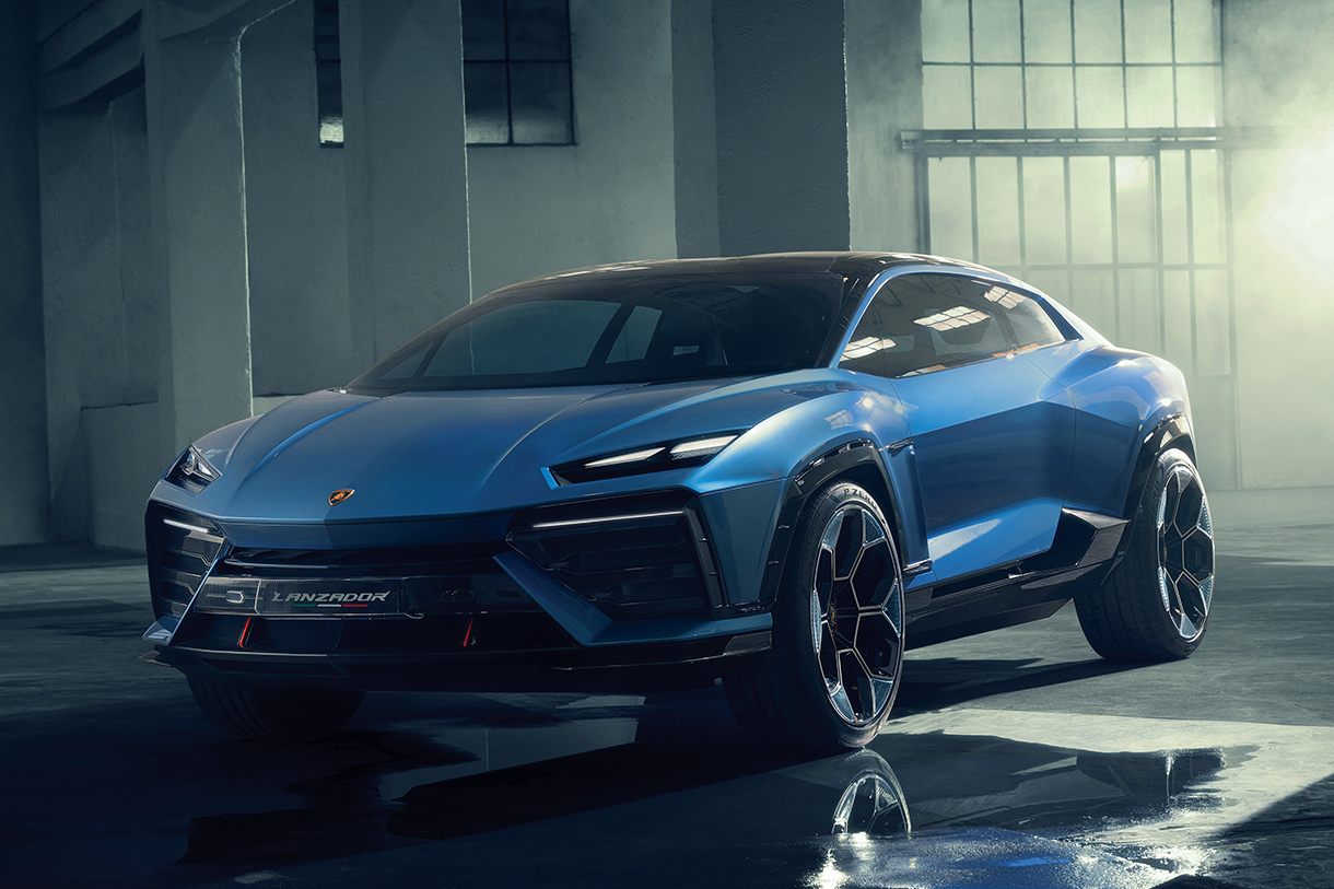 A shiny blue Lamborghini Lanzador 2028 SUV is parked in a well-lit garage. The car has a black roof and wheels, and the Lamborghini logo is visible on the front hood.