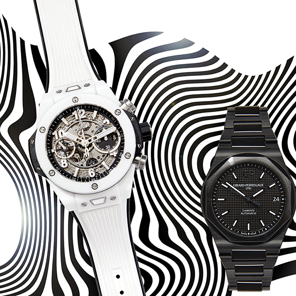 One white and two black ceramic watches on a black and white wavy design backgroun