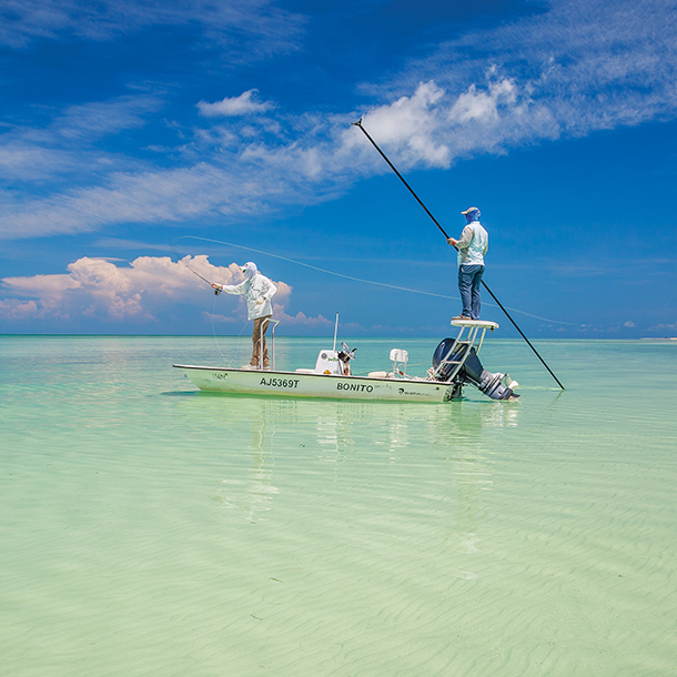 Two men saltwater fly fishing in a small boat at Cuba flats