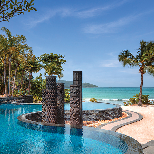 A premier beach pool villa featuring a private outdoor infinity pool with stunning views of the ocean.