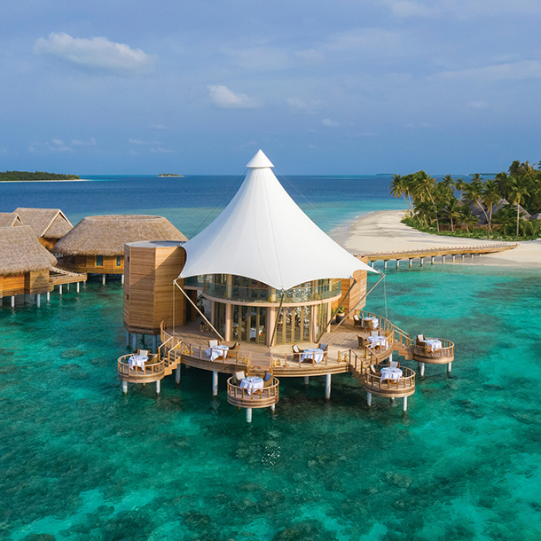 Overwater restaurant positioned over the lagoon with captivating views of the ocean