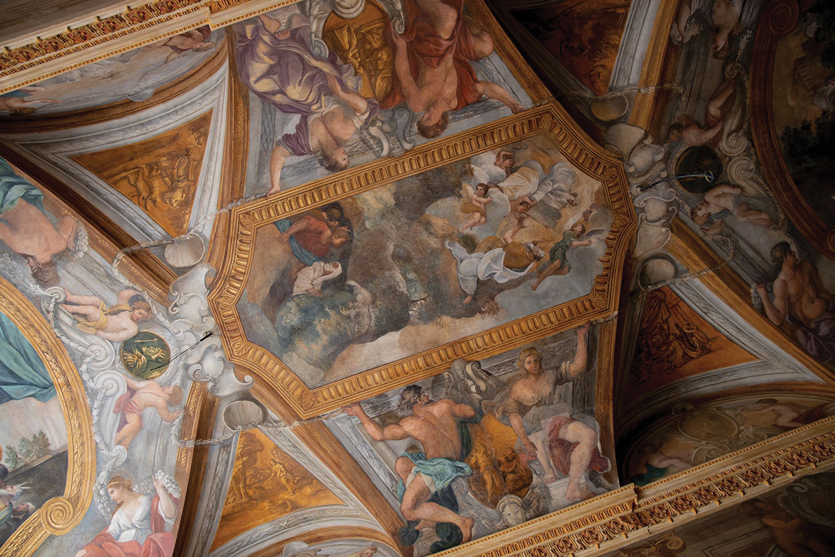 Beautiful coffered ceilings embellished with original frescoes inside an elegant Roman hotel