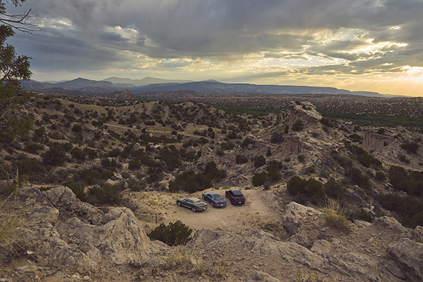 A couple Bentley cars parked at a desert viewing point in outskirts of Sante Fe, New Mexico 
