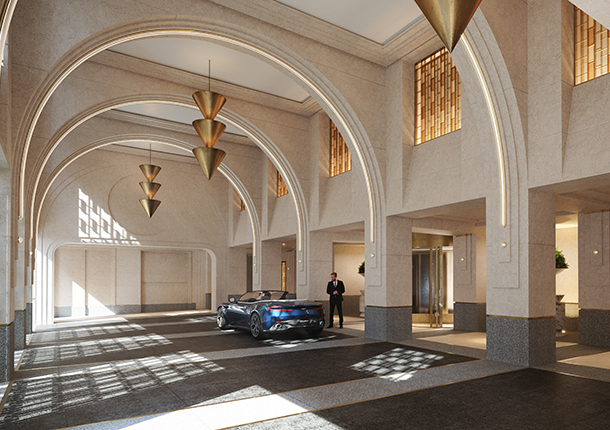 Luxurious entrance to valet parking area of Waldorf Astoria Residences. There is a man wearing a black suit standing next to a blue convertible in a large, brightly lit parking driveway that has vaulted ceilings with arches.