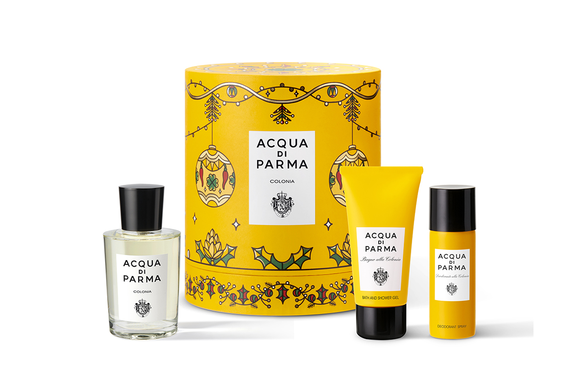 Acqua Di Parma Colonia Gift Set in a citrus colored collectible holiday box containing Eau de Cologne, bath and shower gel, and deodorant spray. 