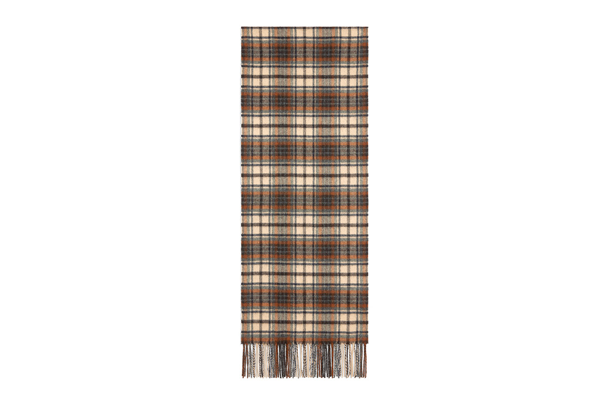 Parisian fashion house Celine easily turns a humble scarf into an instant winter wardrobe staple, thanks to its muted plaid design and sumptuous cashmere fabric.