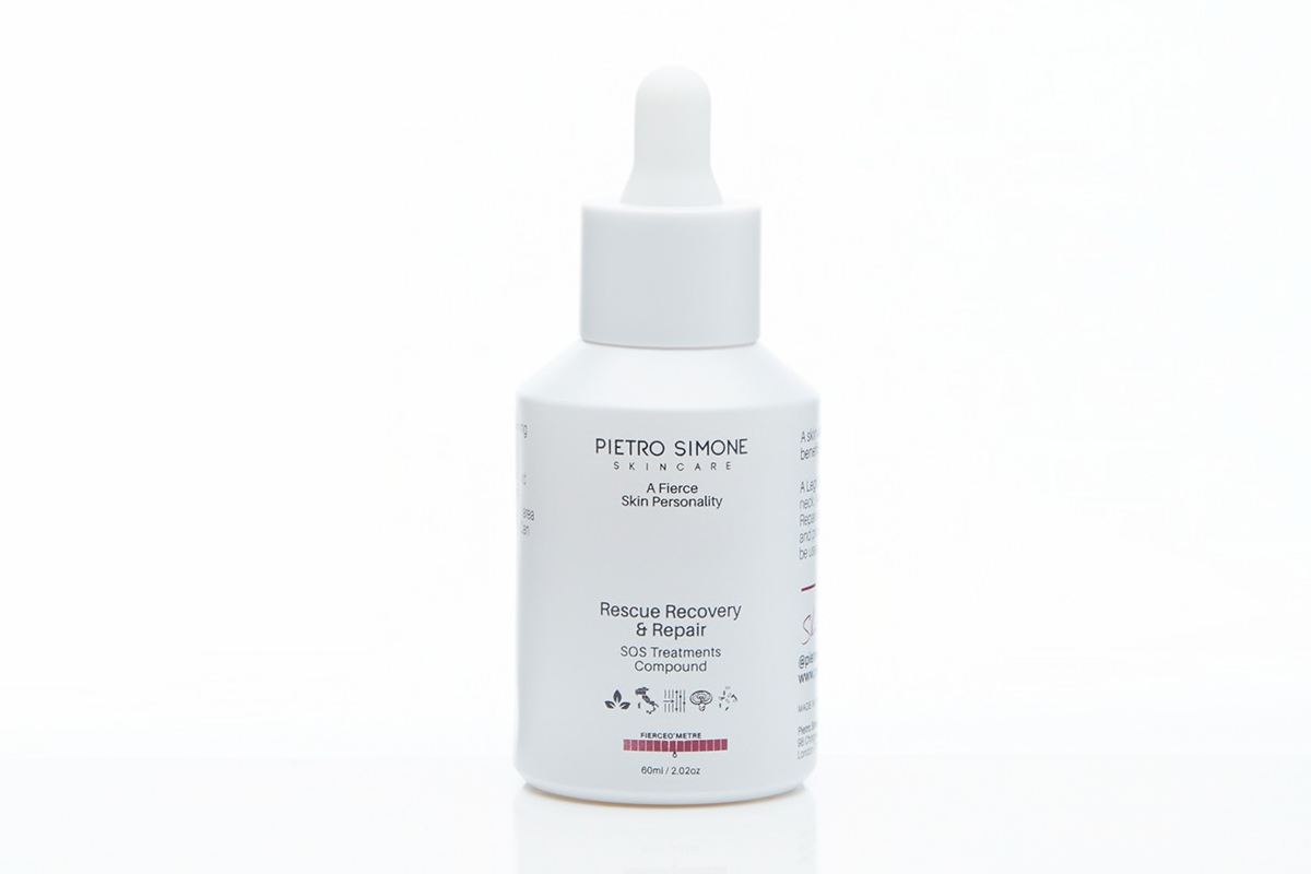 A close-up of a skincare product from the brand Pietro Simone. The product is named "Rescue Recovery Repair" and is in a small glass bottle with a pipette dropper. 