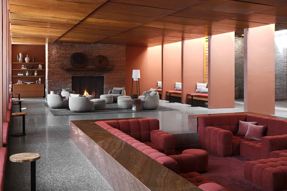 Large Seating area with red couches, a fireplace, and a coffee table.